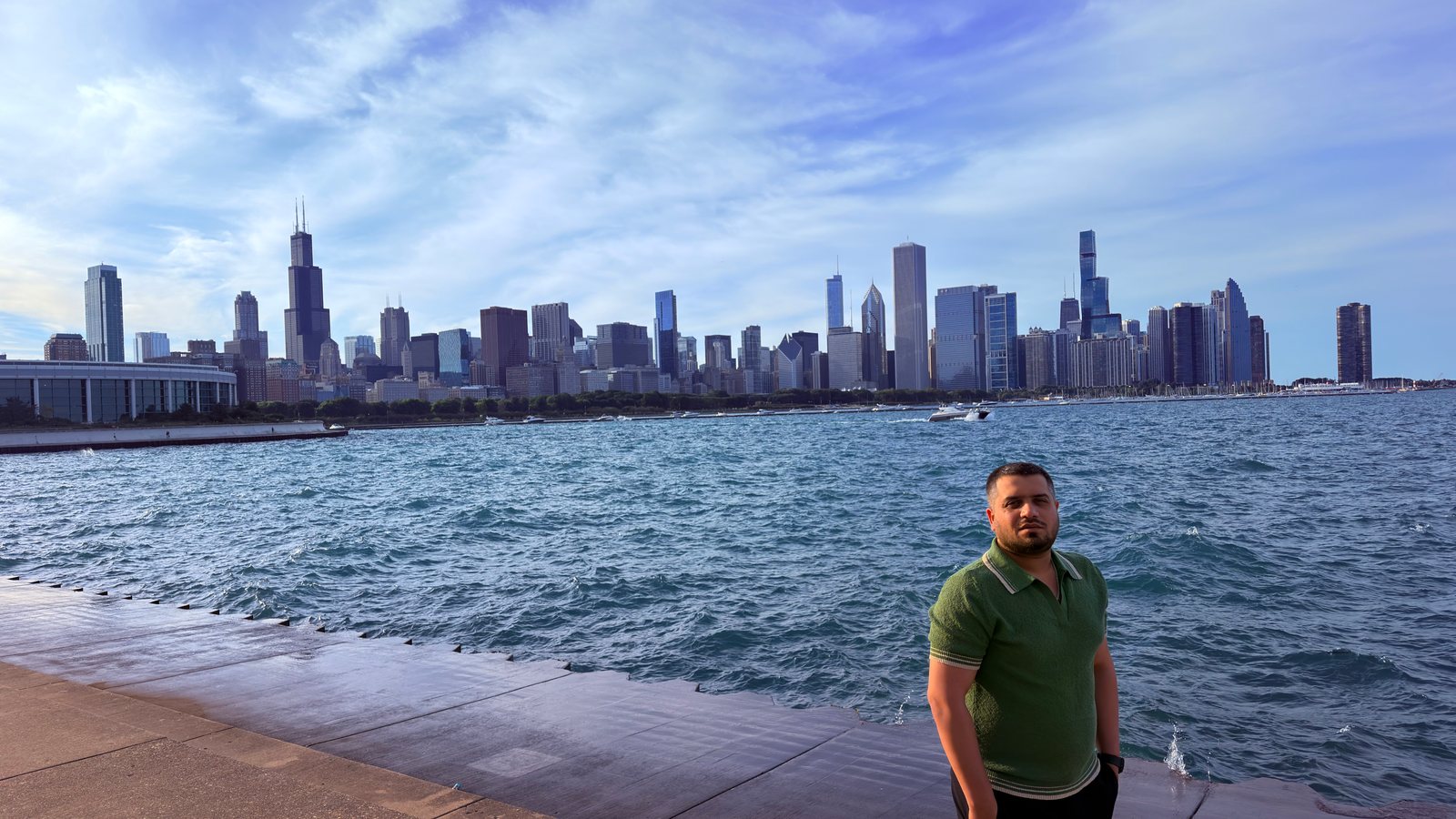 Wali Zuberi on the Chicago lakefront with the downtown skyline across Lake Michigan