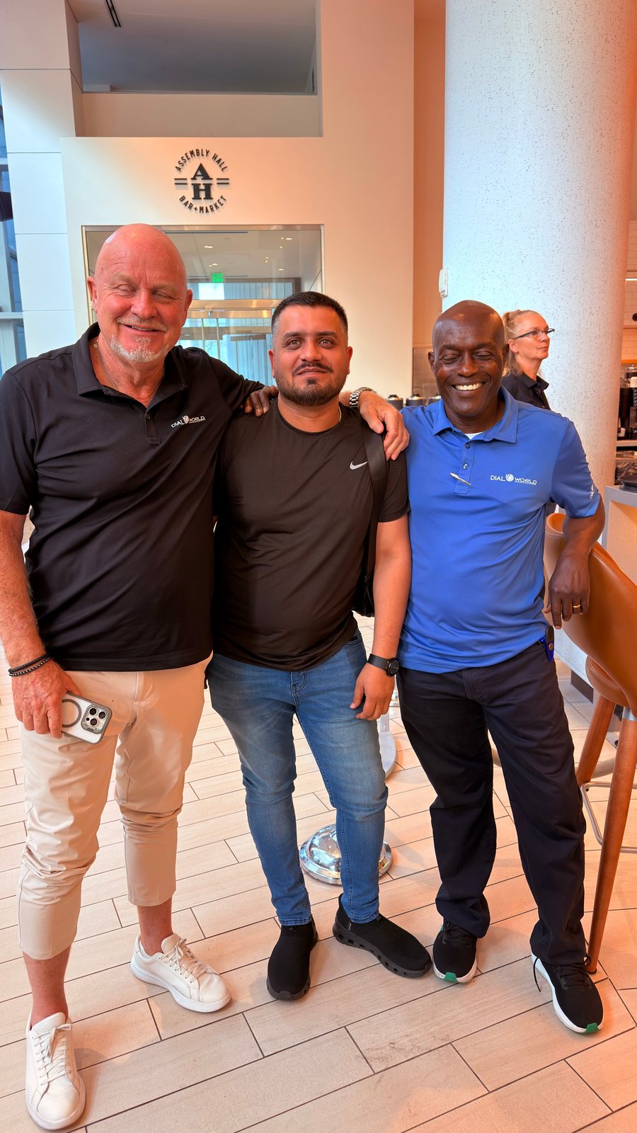 Wali Zuberi with two conference attendees near the Assembly Hall at Contact.io 2026 in Denver