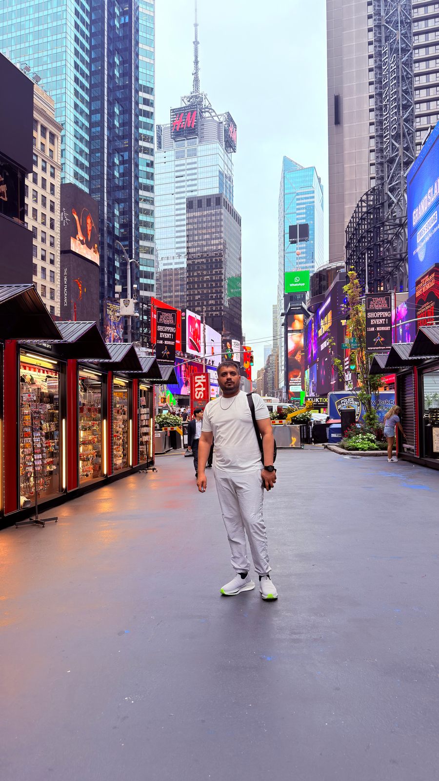 Wali Zuberi standing in Times Square, New York City, during the day