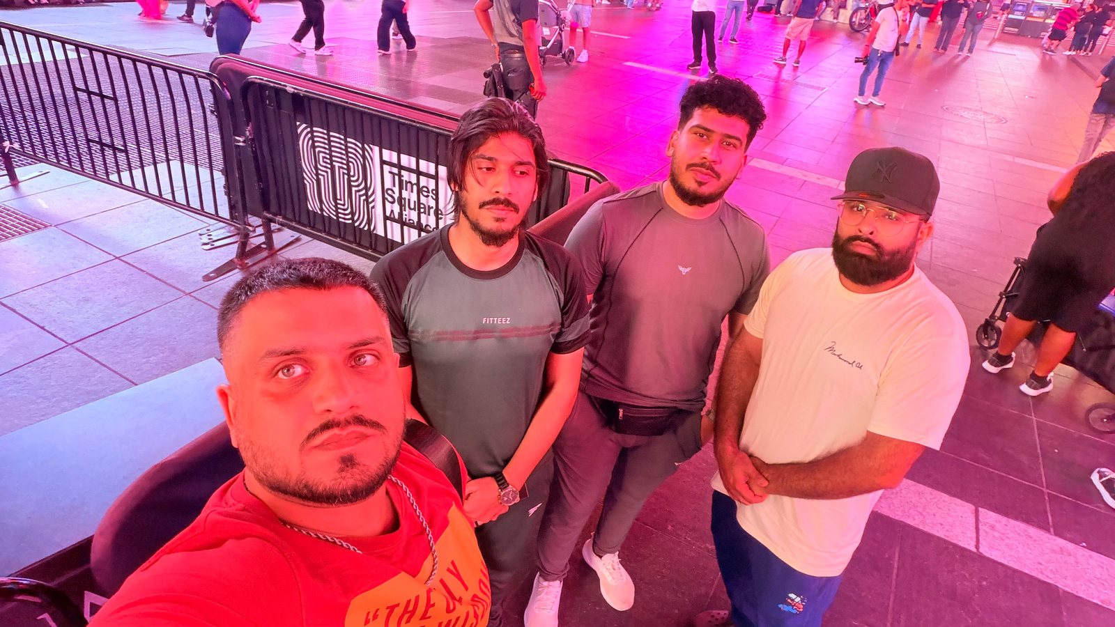 Group selfie of Wali Zuberi with three friends in Times Square, New York City